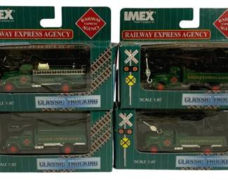 1027 - 4pc Lot IMEX Railway Express Agency Trucks (Description): A four-piece lot of IMEX Railway Express  Agency trucks from the Classic Trucking  series. These 1/87 scale model trucks are  presented in their original packaging.
