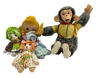 2018 - Assorted Stuffed Animals & Dolls 14" Tall (Description): Lot of assorted stuffed animals and dolls  featuring a variety of charming characters.  The collection includes a vintage-style  cymbal monkey with gray plush fur and yellow  vest, a blonde yarn-haired rag doll, and several smaller stuffed animals dressed in  calico and patterned fabric outfits including  cats, mice, and a bear. Each piece displays  colorful fabric clothing and whimsical  detailing. Largest measures 14 inches tall.