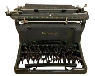 7586 - Vintage Underwood Manual Typewriter (Description): Vintage Underwood manual typewriter in black  finish. This classic office machine features  the traditional QWERTY keyboard layout with  round glass keys accented by green function  keys. The typewriter displays the iconic Underwood branding on the paper guide and  front frame. Shows wear consistent with age  and use. Measures 10" x 17" x H". Used as is  electric/electronic/mechanical item. No  guarantee all components present, untested.