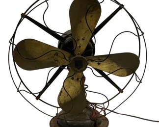 1553 - Gray Bar Electric Fan 19"x17"x9" (Description): Vintage Gray Bar electric fan featuring four  brass blades with a black motor housing and  wire cage guard. The fan sits on a round cast  iron base and displays characteristic early  20th century industrial design. Shows age-appropriate wear and patina consistent  with its era. Measures 19 inches by 17 inches  by 9 inches. Used as is electric/electronic/mechanical  item. No guarantee all components, untested.