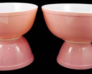 1128 - Pyrex Flamingo Pink 4pc Bowl Set 4"x10" (Description): Pyrex Flamingo Pink four-piece bowl set  featuring the classic mid-century pink  exterior with white interior. The set  includes nesting mixing bowls in graduated  sizes. Measures 4 inches by 10 inches.