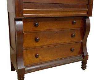 7687 - Antique  American Empire Chest of Drawers (Description): Antique American Empire style chest of  drawers crafted with a rich, warm finish.  This handsome piece features four graduated  drawers with wooden knob pulls, flanked by  elegant S-scroll pilasters on either side. The chest rests on turned feet and displays  the characteristic bold curves of the Empire  period. The top includes a hidden glove  drawer above the main storage drawers.  Measures 44 inches high by 44 inches wide by