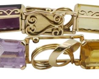 834 - 18K Gold Multi-Gemstone Link Bracelet 1.21oz (Description): An elegant 18k gold link bracelet featuring  multiple emerald-cut gemstones in a variety  of colors including amethyst, citrine,  aquamarine, peridot, and yellow quartz. The  bracelet showcases decorative scrollwork links alternating with the gemstone settings,  secured with a fold-over clasp. Total  weight: 1.21 oz.