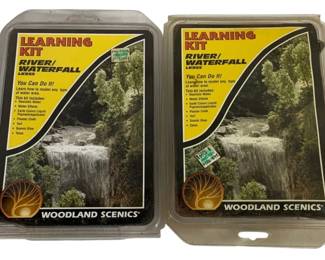 1056 - 2 pc Lot Woodland Scenics Railroad Kits (Description): Two piece lot of Railroad Rail Learning Kits  by Woodland Scenics. These River/Waterfall  learning kits are designed to teach modeling  techniques for water areas and include  realistic water effects, earth colors liquid pigment/applicator, plaster cloth, turf,  scenic glue, and talus.