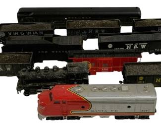 1647 - 11pc Lot HO Scale Trains (Description): A collection of 11 HO scale model trains  featuring various locomotives and rolling  stock. The lot includes a Santa Fe 307 diesel  locomotive in the classic red, yellow, and  silver warbonnet livery, a black steam locomotive, several Norfolk & Western(N&W)  coal hoppers, a Virginian hopper car, a  Pullman passenger car, and an ATSF caboose.  The freight cars are predominantly finished  in black with authentic railroad markings.