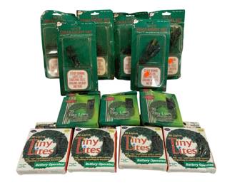 1612 - 12pc Lot Tiny Lites Battery Operated Lights (Description): A collection of twelve packages of miniature  battery-operated Christmas lights. The lot  includes four packages of 10-count Xmas Light  Sets featuring steady burning lights for  Christmas trees, garland, wreaths, and more. Also included are four packages of 20 Tiny  Lites with clear bulbs on green wire, and  four packages of 20 Lights Tiny Lites, all  battery operated with rice-style lights  offering flashing or steady-on functions. All