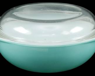 1034 - Pyrex Turquoise Blue Casserole w/ Lid (Description): Pyrex turquoise blue casserole dish with  original clear glass domed lid. The bowl  features the classic mid-century robins egg  blue color in solid opaque glass with tab  handles on either side. The lid is clear glass with a smooth dome shape. Measures 5  inches tall by 10 inches wide by 8 inches  deep.