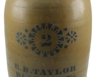 599 - E.B. Taylor Richmond VA 2 Gallon Crock 12" (Description): E.B. Taylor Richmond, VA 2 gallon stoneware  crock featuring cobalt blue stenciled  decoration with the number 2 flanked by  decorative medallions. The maker's mark "E.B.  Taylor Richmond. Va." is stenciled below. Measures 12 inches tall.