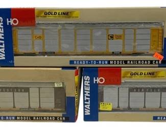 1619 - 3pc Walthers Gold Line HO Scale Train Cars (Description): Three Walthers Gold Line HO scale  ready-to-run model railroad cars in original  packaging. The lot includes boxcars featuring  Chessie System C&O and Norfolk and Western  railroad liveries. All cars appear complete in their original boxes.