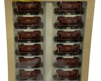 1606 - Walthers Gold Line 10pc HO Train Car Set (Description): Walthers Gold Line 10-piece train car set  featuring superbly detailed HO scale plastic  kit ore cars. The set includes ten DM&IR  (Duluth, Missabe and Iron Range Railway)  hopper cars in brown livery with various road numbers. Part of Walthers' Gold Line series  featuring turned metal wheels and McHenry  couplers. Original packaging included.