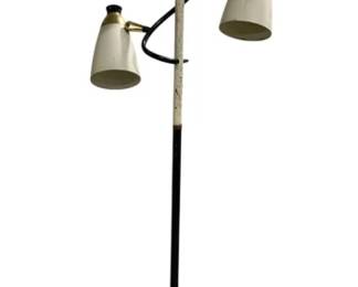 7613 - Mid-Century Modern 3-Light Floor Lamp (Description): Mid-century modern floor lamp featuring three  adjustable cone-shaped shades in cream or  off-white finish. The lamp has a black metal  pole with brass accent details at the shade  connections and a weighted round base with gold-tone center detail. Each shade appears  to be individually adjustable for directed  lighting. The design is characteristic of  1950s-1960s modern styling. Used as is  electric/electronic/mechanical item. No