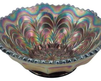 700 - Fenton Cobalt Peacock Trail Carnival Bowl (Description): Vintage Fenton cobalt blue Peacock Trail  carnival glass bowl featuring a stunning  iridescent finish with purple, blue, green,  and gold hues. The bowl displays the classic  Peacock Trail pattern with radiating feather-like designs emanating from the  center, and features a scalloped crimped  edge. Measures 2 inches tall by 5.5 inches in  diameter.