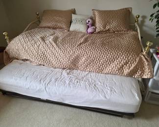 Day bed with trundle bed underneath.
