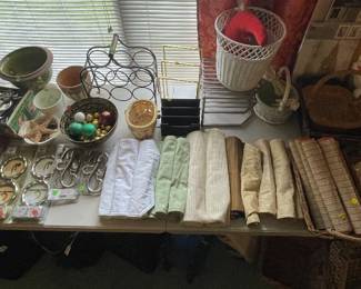 Misc. table cloth, baskets, wine rack, pots, storage, travel suitcase tags