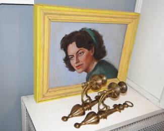 Portrait art and brass candle holders