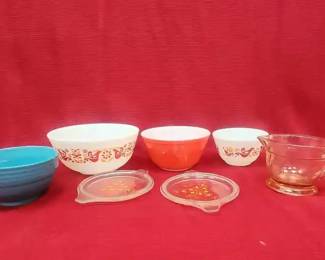 Vintage mixed kitchenware lot featuring colorful midcentury mixing bowl,