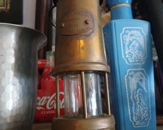 vintage brass miner's safety lamp produced by the Hockley Lamp & Limelight Company.