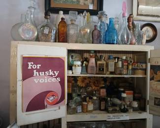 Vintage perfume bottles, apothecary jars, lotions, and soap products