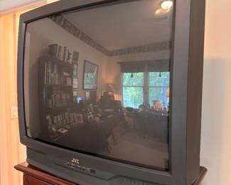 JVC tube TV on wood media cabinet