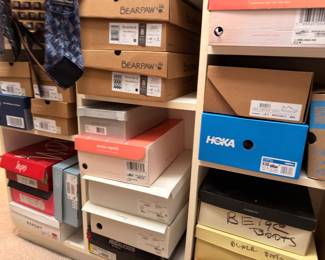Hoka, Bearpaw and Report shoes in boxes
