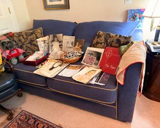 Navy blue sofa with memorabilia display