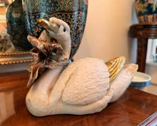 Carved ceramic swan figure with gilt accents