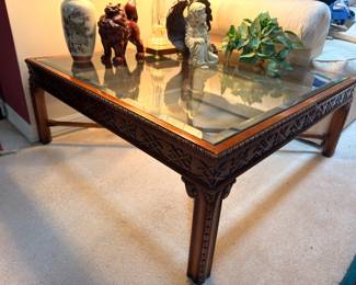 Chippendale style carved glass top coffee table
