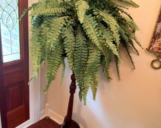 Faux fern on mahogany candle stand