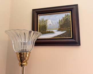 Framed mountain landscape oil painting and torchiere lamp