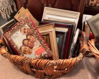 Basket of assorted picture frames