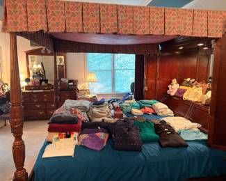 Four poster canopy bed and women's clothing