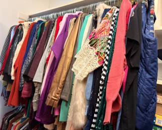 Rack of women's tops, sweaters and evening wear