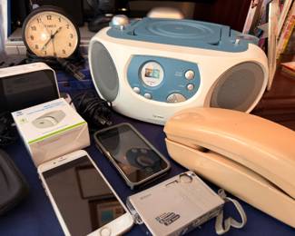 iPhones, CD boombox, Timex clock and camera