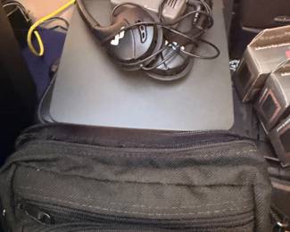 Laptop, headphones and travel bag