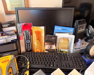 Kindle Oasis, monitor, keyboard and remotes
