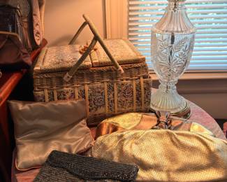 Evening bags, wicker basket and crystal lamp