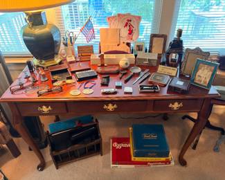 Queen Anne writing desk with vintage games and collectibles