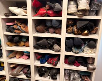 Shoe cubby full of women's heels and flats