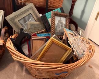 Wicker basket of picture frames