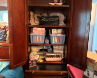 Cherry armoire with craft and sewing supplies