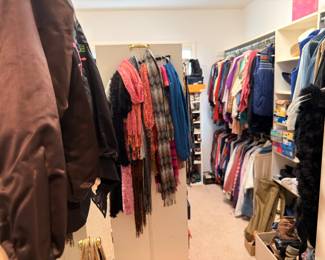 Closet of women's clothing, scarves and shoes
