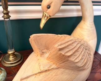 Carved wood swan figure with brass candlestick