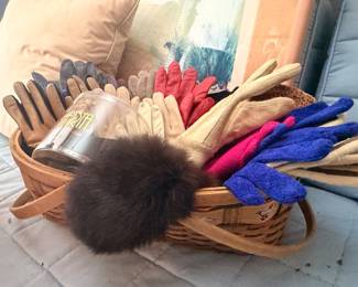 Basket of leather and knit winter gloves