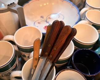 Coffee mugs, steak knives and stoneware bowls