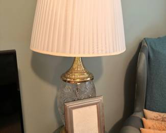 Crystal and brass table lamp on green marble stand