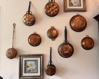 Vintage copper pots, pans and molds wall collection