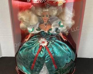 Several Holiday Barbies