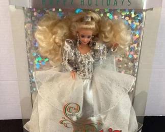 Several holiday Barbies