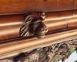 All hand carved Lions head on drawer