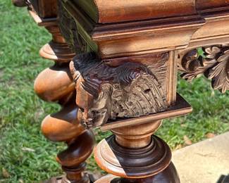 And hand carved cherubs on each leg and under drawer